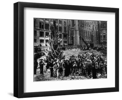Construction Workers Line up for Pay Beside the First Rockefeller Center Christmas Tree - Black Framed Art Print Wall Art, 12x9