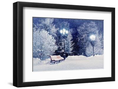 Winter Night Landscape Scene of Snow Covered Bench among Snowy Trees and Shining Lights during Snow - Black Framed Art Print Wall Art, 12x8