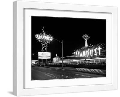 1960s Night Scene of the Stardust Casino Las Vegas,, Nevada - White Framed Art Print Wall Art, 16x12
